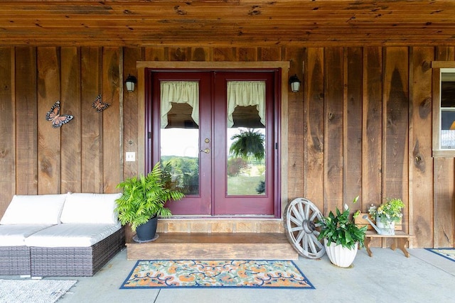 view of exterior entry featuring french doors