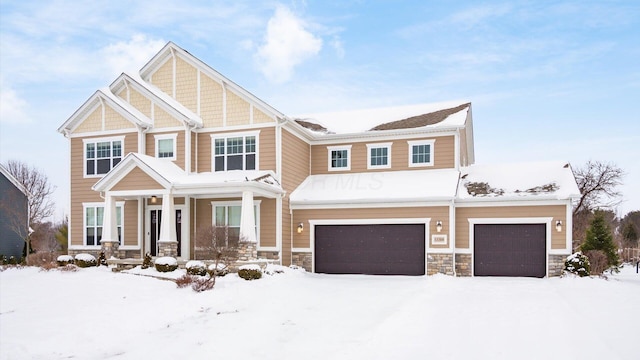 craftsman house with a garage