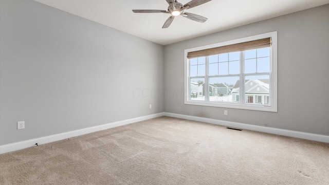 unfurnished room featuring carpet flooring and ceiling fan