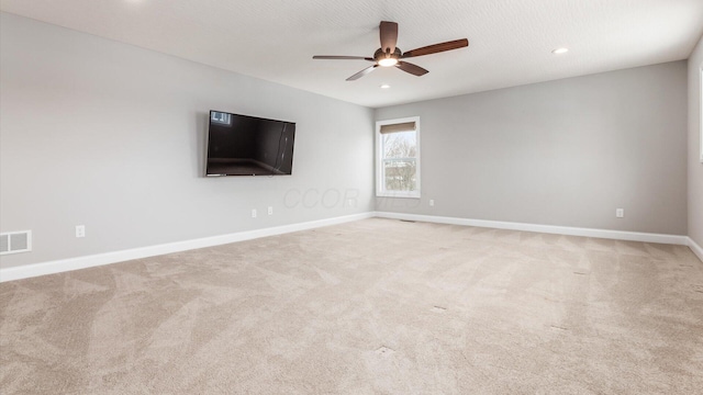 unfurnished room with light carpet and ceiling fan