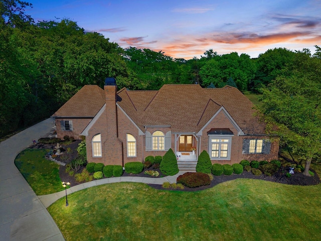 view of front of home with a lawn