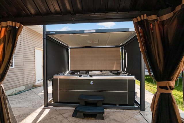 view of patio / terrace with a hot tub