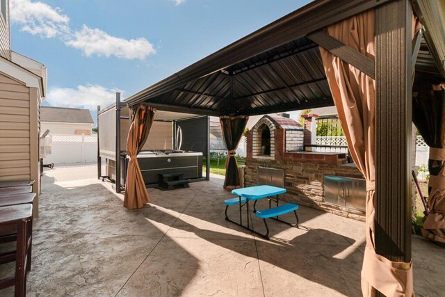 view of patio / terrace with a gazebo and a trampoline