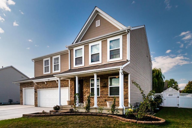 view of front of house featuring a front yard and a garage