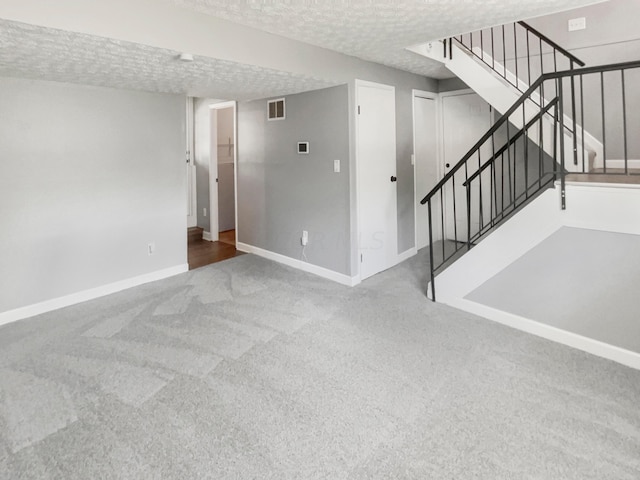 interior space featuring a textured ceiling