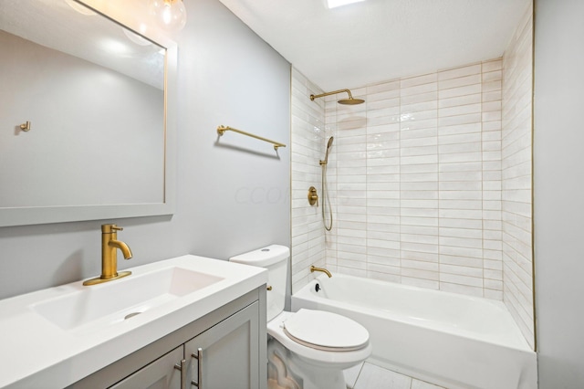 full bathroom featuring tile patterned floors, vanity, toilet, and tiled shower / bath