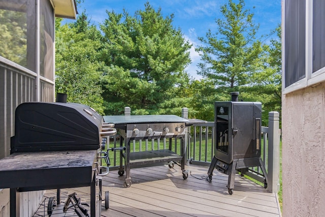 deck featuring a grill