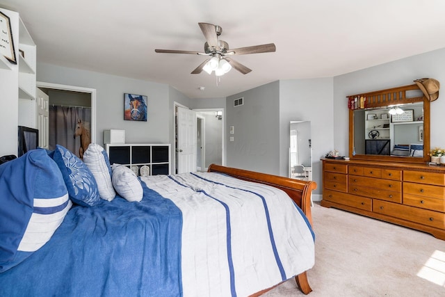 carpeted bedroom with ceiling fan