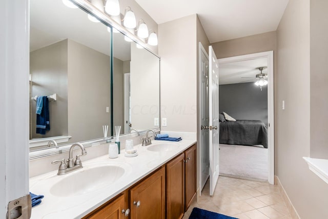 bathroom with ceiling fan, tile patterned flooring, and vanity