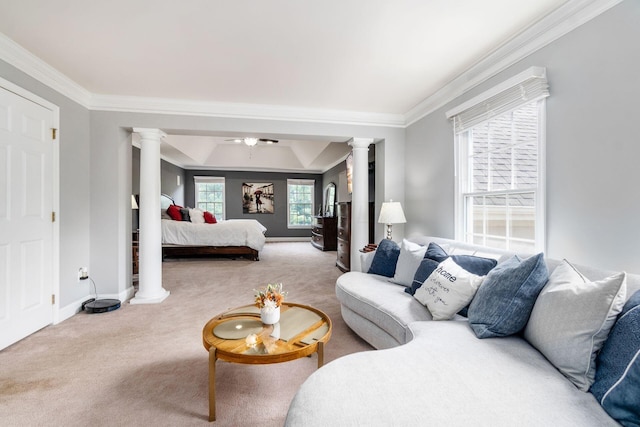 carpeted bedroom with ornate columns and crown molding