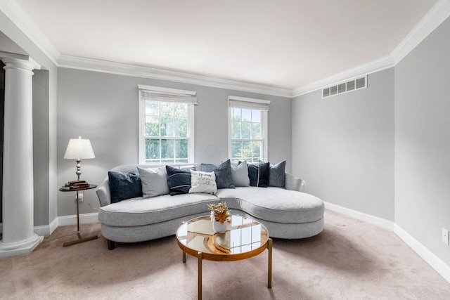 living room with decorative columns, carpet, and ornamental molding