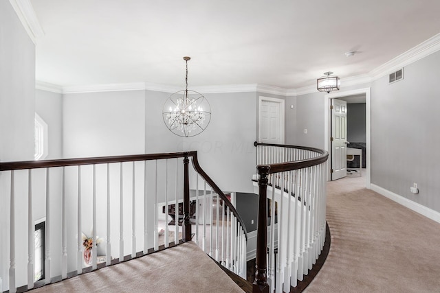 hallway with light carpet, crown molding, and a notable chandelier