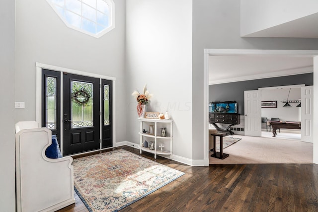 entrance foyer featuring dark hardwood / wood-style floors, high vaulted ceiling, and pool table