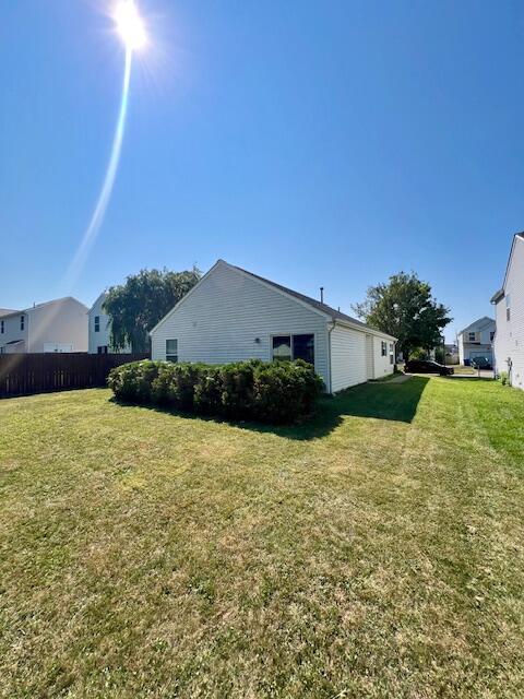 view of side of property featuring a lawn