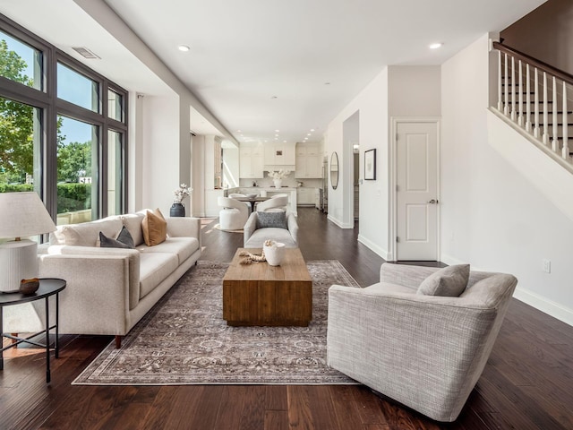 living room with dark hardwood / wood-style floors