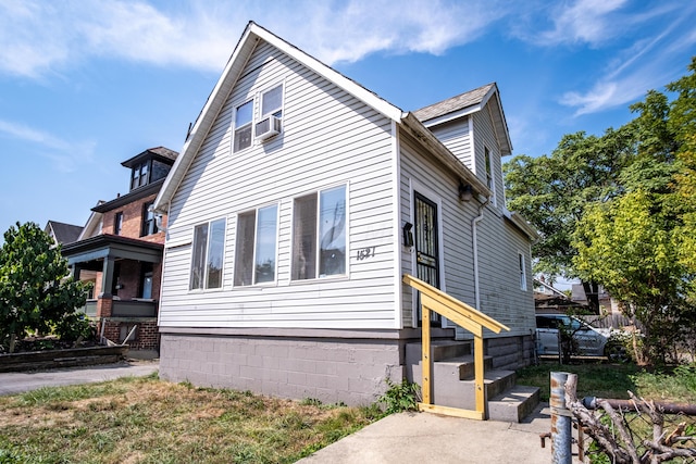 view of side of property featuring cooling unit