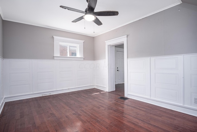 unfurnished room with dark hardwood / wood-style floors, ceiling fan, and crown molding