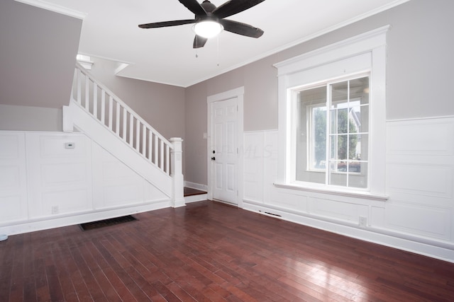 entryway featuring dark hardwood / wood-style flooring, ceiling fan, and crown molding