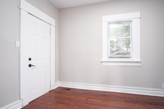 entrance foyer with dark hardwood / wood-style flooring