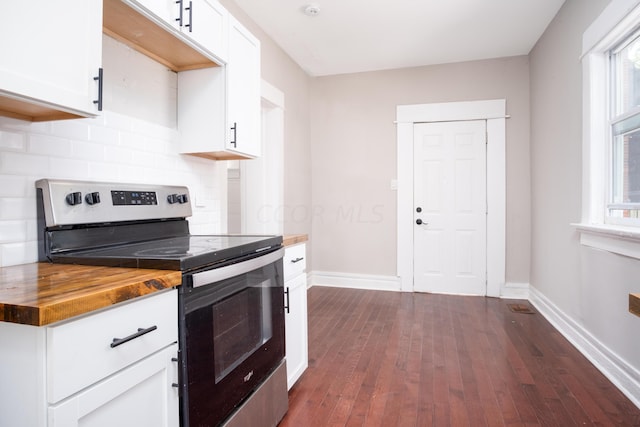 kitchen with white cabinetry, butcher block counters, stainless steel range with electric cooktop, and dark wood-type flooring