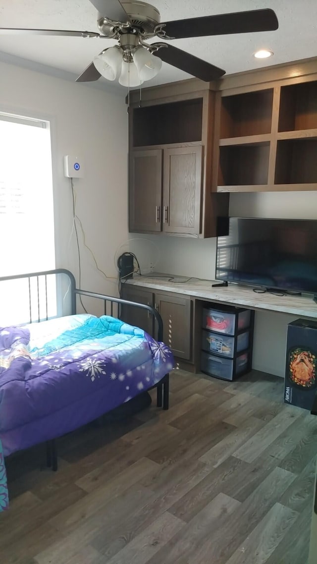 bedroom featuring dark hardwood / wood-style flooring and ceiling fan