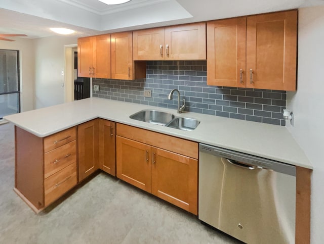 kitchen featuring decorative backsplash, kitchen peninsula, ceiling fan, sink, and dishwasher