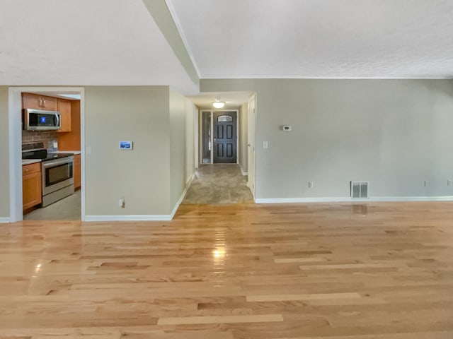 unfurnished living room featuring light hardwood / wood-style flooring