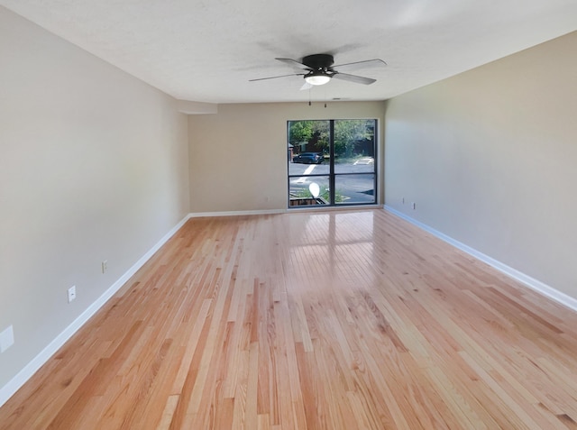 unfurnished room with ceiling fan and light hardwood / wood-style flooring