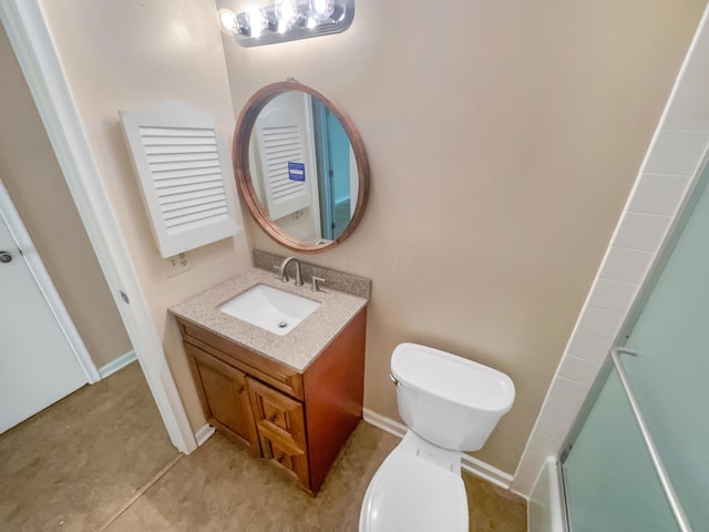 bathroom featuring tile patterned floors, toilet, vanity, and walk in shower