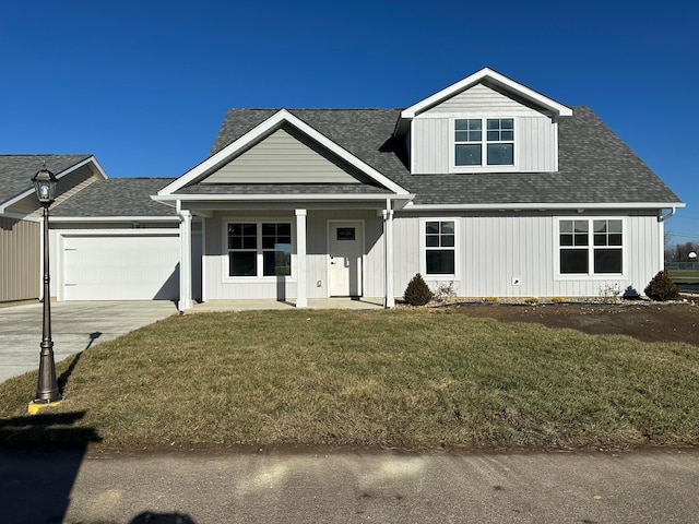 view of front of home featuring a front yard and a garage