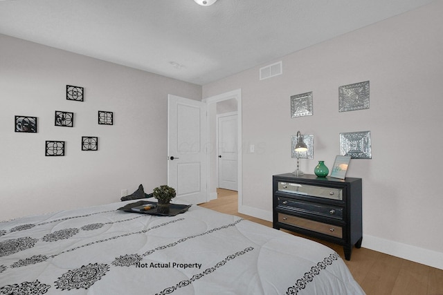 bedroom featuring hardwood / wood-style flooring