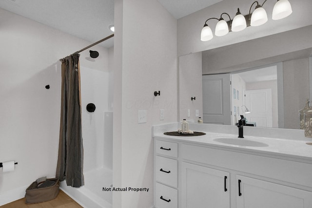 bathroom featuring vanity, a shower with curtain, and hardwood / wood-style floors