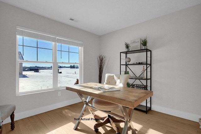 home office with hardwood / wood-style floors