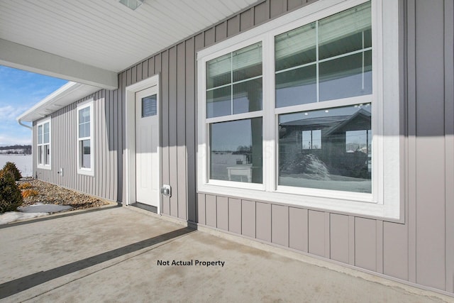 entrance to property with a patio