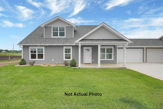 102 Cumberland Meadows Cir, Hebron, OH 43025 - view of front of home featuring concrete driveway, a porch, a front lawn, roof with shingles, and a garage