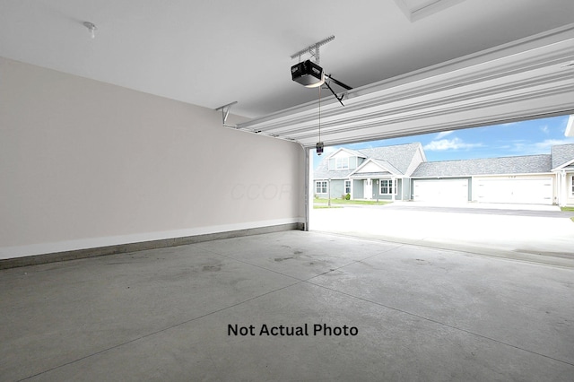 102 Cumberland Meadows Cir, Hebron, OH 43025 - garage with a garage door opener and baseboards