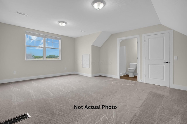 102 Cumberland Meadows Cir, Hebron, OH 43025 - additional living space featuring carpet flooring, baseboards, and vaulted ceiling