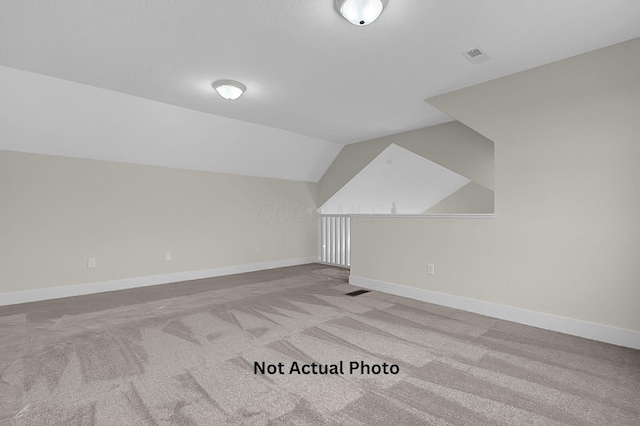 102 Cumberland Meadows Cir, Hebron, OH 43025 - bonus room featuring carpet flooring, lofted ceiling, and baseboards