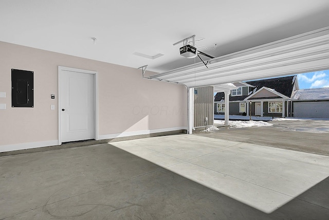 garage featuring electric panel and a garage door opener