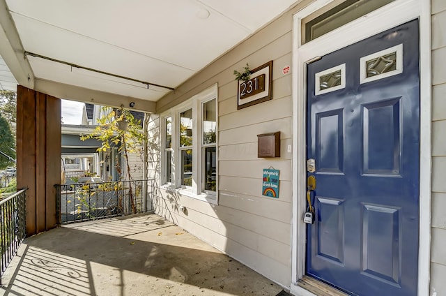 doorway to property featuring a porch