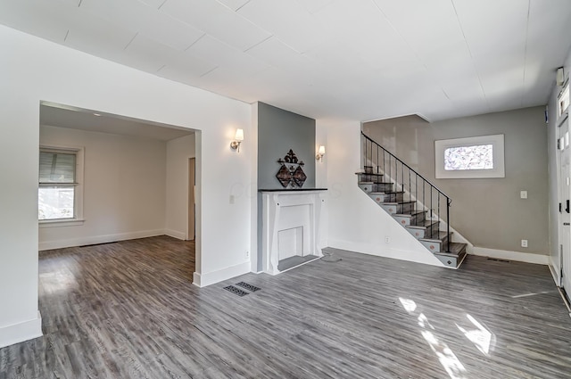 unfurnished living room featuring hardwood / wood-style floors