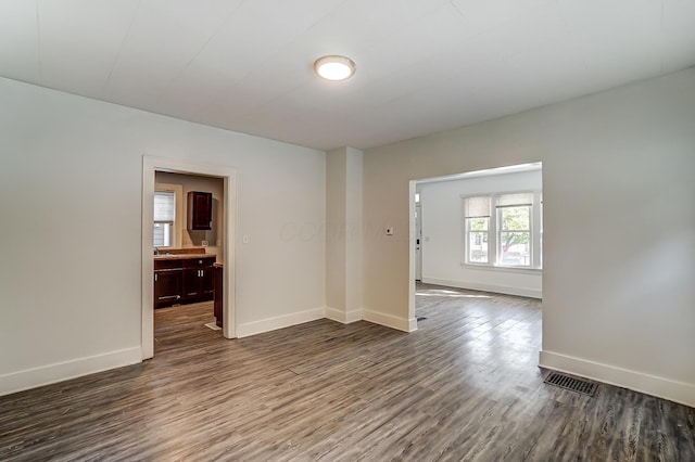 empty room featuring dark hardwood / wood-style floors