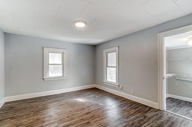 spare room featuring dark hardwood / wood-style floors