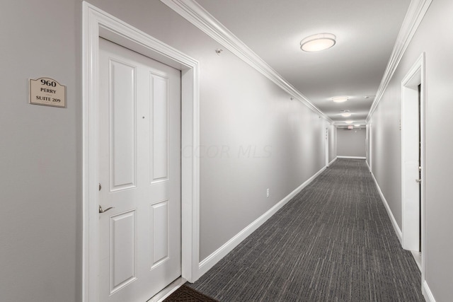 corridor with dark carpet and ornamental molding