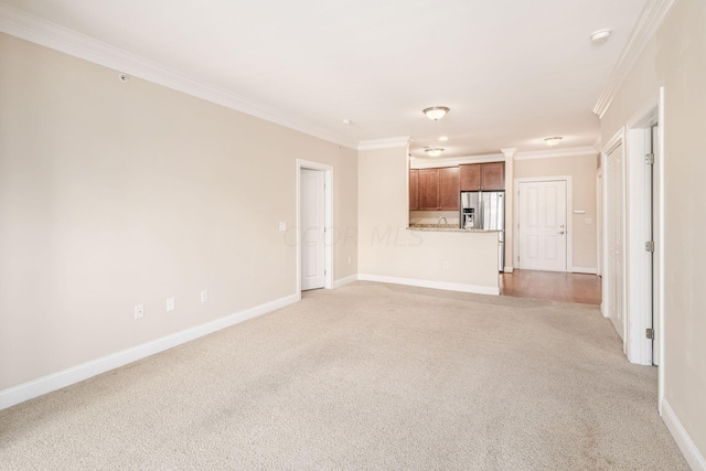 unfurnished living room featuring light carpet and ornamental molding