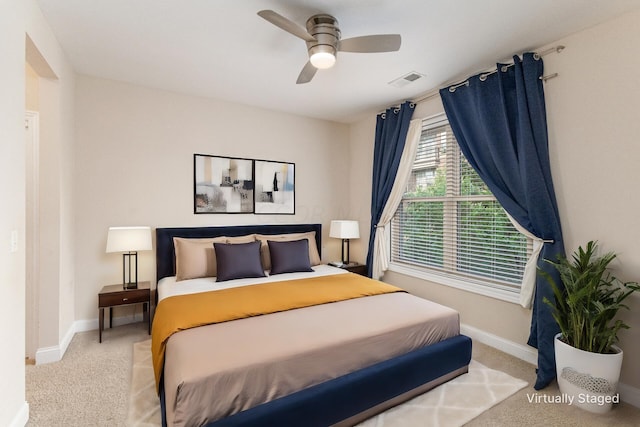 bedroom with light colored carpet and ceiling fan