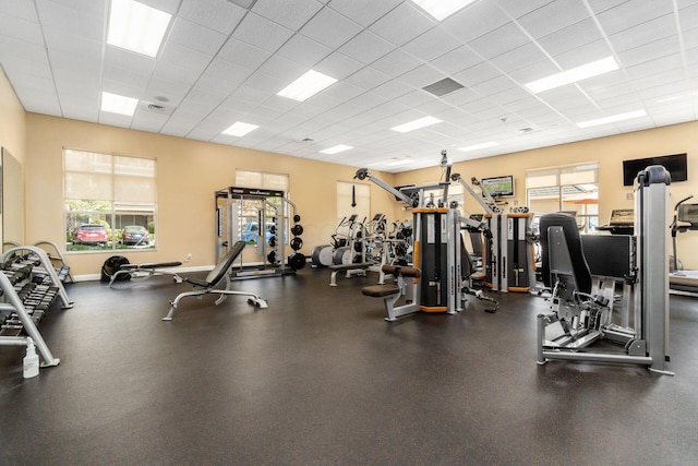 exercise room with a drop ceiling