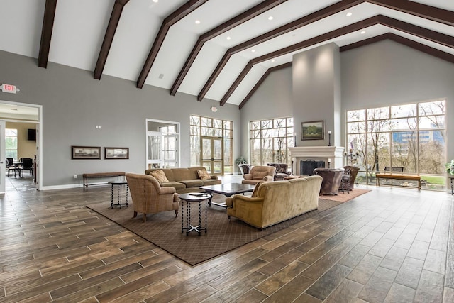 living room with beamed ceiling, dark hardwood / wood-style floors, and high vaulted ceiling