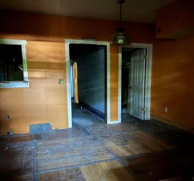 empty room with hardwood / wood-style flooring