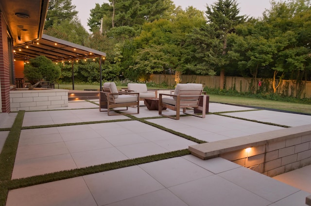 view of patio featuring fence